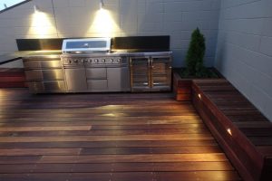 Landscape outdoor living area with bbq and deck
