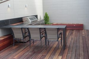 Outdoor BBQ are with kitchen and deck