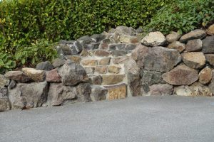 Rock Steps on top of exposed aggregate concrete