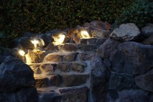 Landscape construction built in rock steps with outdoor lighting