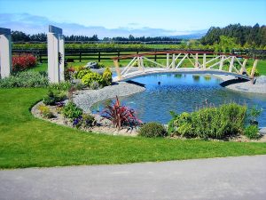 Contemporary garden landscapes with an elegant bridge